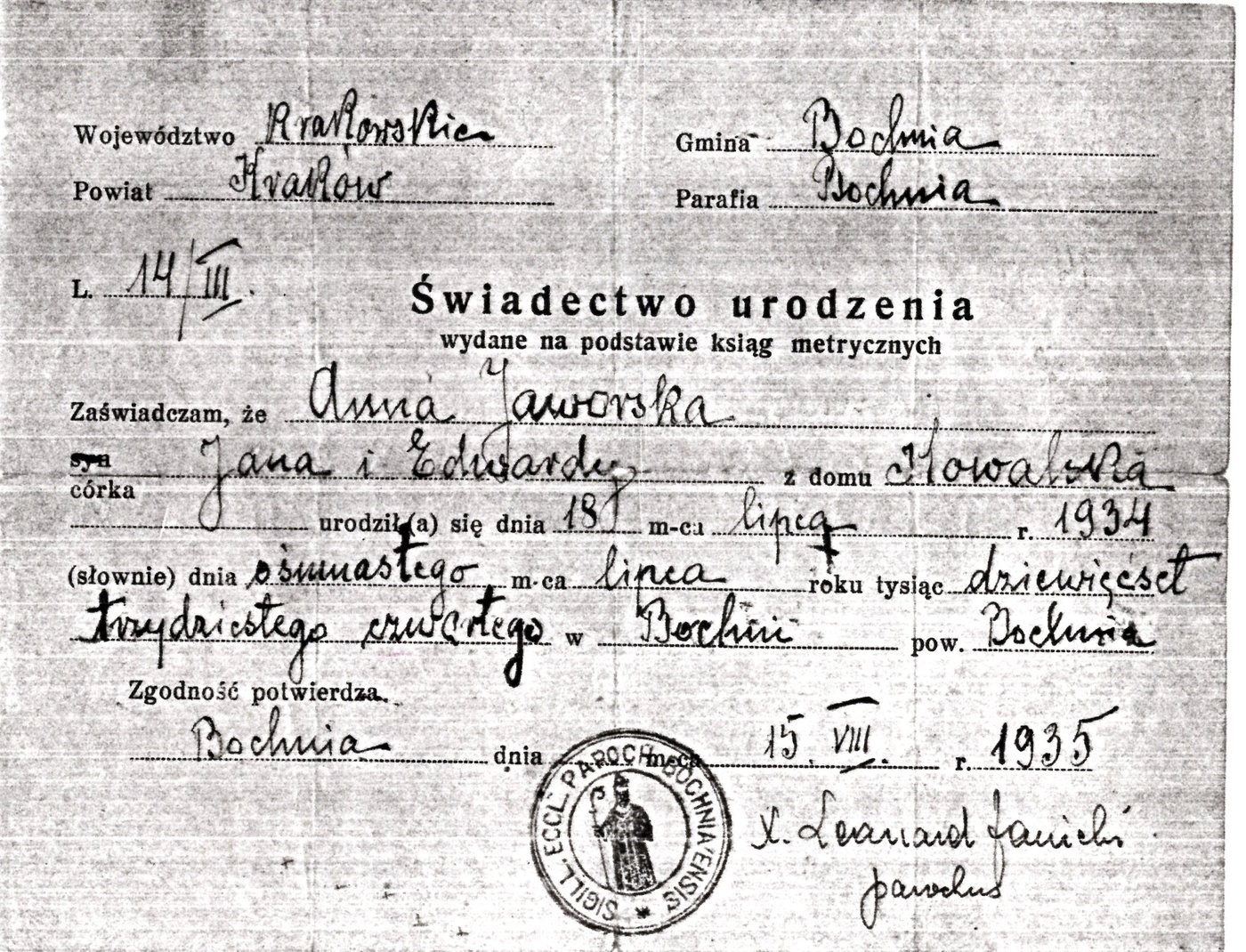 A scanned Polish birth certificate with handwritten entries, a printed heading reading &ldquo;&Sacute;wiadectwo urodzenia&rdquo;, and a round parish stamp at the bottom.